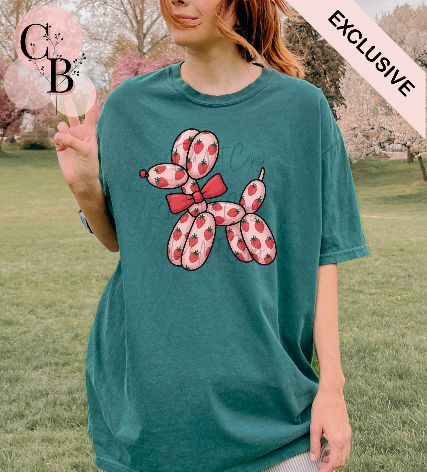 Strawberry-colored balloon dog sculpture by Creative Butterfly, featuring a shiny, whimsical balloon animal design.